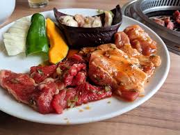 Thinly sliced choice sirloin marinated in garlic, ginger and japanese spices prepared with teriyaki sauce $ 14.99. Yakiniku Chicken