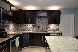 The backsplash is tumbled 4x4 travertine tile with a little accent behind the stove. Colonial White Granite Countertops Pictures Cost Pros And Cons
