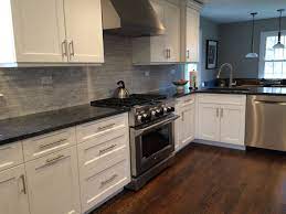 White ice granite is a beautiful granite countertop color choice to pair with white kitchen cabinets and white subway tiles. Counters Are Polished Steel Gray Granite Backsplash Is Carrara Random Tile Honed White The Kit White Granite Countertops Kitchen Remodel Kitchen Design