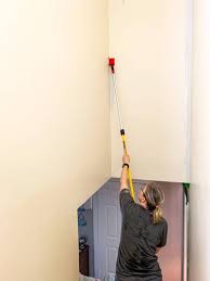 We started by cutting in around the ceiling, corners, and along the stairs. The Inexpensive Way To Paint A Stairwell Real Creative Real Organized