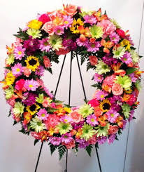 Can sympathy flowers be colorful. Circle Of Life Wreath In Bright Garden Colors Sympathy Flowers Colorful Garden Funeral Flowers