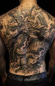 A back tattoo that fits perfectly behind the neck. 20 Cool Back Tattoos For Men In 2021 The Trend Spotter