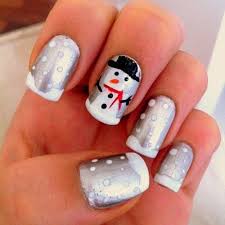 Abstract blue nails with silver dots and stripes design nail art. 51 Festive Christmas Nail Art Ideas Holiday Nail Designs 2021 Guide