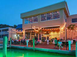 Sunset on the dockside patio. Dry Dock Waterfront Grill Featured In Gay Sarasota Our Travel Guide To Our Favorite Restaurants In Sarasota Gecko S Grill