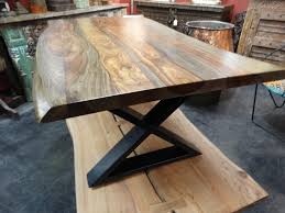 It means some are made from longer wood slabs, while others are made from slices of a tree trunk and burl anomalies. Refined Live Edge Coffee Table Features A Smooth Finish With An X Base