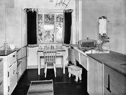 The work surface conjures up original enamelled designs of the era, but is in fact modern white corian with a black edge detail. 1930s Kitchens 08 02 06 Karen Mortimer S Blog