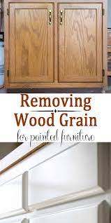 The cupboard doors look like they need more coats of paint as there are bluish streaks showing through in some of the grain. Filling Wood Grain Before Painting Oak Cabinets Craving Some Creativity