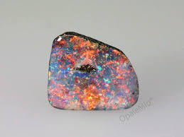 The precious opal is found in ironstone boulders (iron stained sandstone). Black Boulder Opal