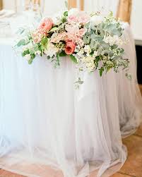 Tips on creating a rustic and romantic wedding with unique ideas for isle markers, lighting, table decorations and flower arrangements. Unexpected Ways To Use Tulle Throughout Your Wedding Martha Stewart