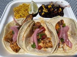 So come on over and take a look at the lot that this lovely lady will be on soon and let's grab fish tacos and an ice cold beverage at fibber's down the street. Sampling Seafood On Sanibel Captiva Islands Florida Real Food Traveler