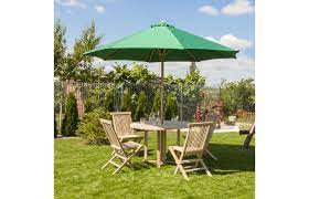 This kid's size parasol umbrella is handmade from bamboo and fabric. Set Of Garden Furniture Table 4 Chairs And Umbrella