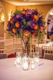 Your Wedding In Colors Rustic Orange And Purple Wedding Table Flowers Purple Wedding Centerpieces Flower Centerpieces Wedding