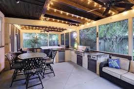 In this space, wood and simple brick complement the small space, providing prep areas and a base for the grill. Enclosed Patio Ideas Design Pictures Designing Idea