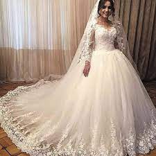 Check out our designer collections + wedding dress inspiration board for more wedding dress inspiration. Discountspring 2020 New Princess Ball Gown Wedding Dresses Modest Neckline Big Puffy Skirt Court Train Ivory Long Sleeve Bridal Gowns Custom Made From Magicwedd Ball Gowns Wedding Long Sleeve Bridal Gown