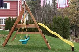 Standing on ladder, use measuring tape to determine exact width of crossbeam starting how to build a transitional double swing set: Swing Set Build