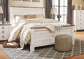 The ultimate look for a beach cottage or shabby chic inspired retreat, this queen sleigh bed set carries you away to a dreamy time and place. Willowton Whitewash Queen Panel Bed