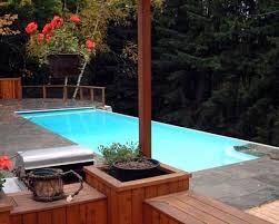 Infinity Edge Above Ground Pools Inground Above Ground Swimming Pools Custom Concrete Fiberglass Fiberglass Pools Swimming Pool Kits Swimming Pools