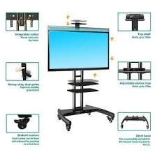 The shelf on the trolley has an adjustable height and the floor stand holds a weight up to 55lbs. Top 10 Best Rolling Tv Stands For Flat Screen 2021 Reviews Guides Flat Screen Tv Stand Tv Stand Rolling Tv Stand