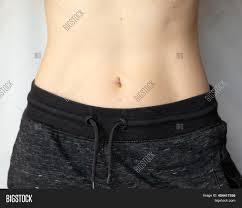 Small projection of a woman's or girl's breast. Flat Female Belly Image Photo Free Trial Bigstock