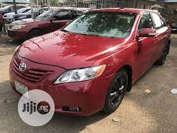 toyota camry 2008 red the car is super clean and sharp perfect engine and gear very chilling ac creamy leather seat reverse camer toyota camry camry toyota