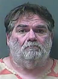 Father Charged with Killing Dogs, Son Accused of Cover-Up