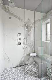 White And Gray Mosaic Bathroom Tiles Continue Into A Seamless Glass Shower Fitted With Two Polished Nickel Shower He Mosaic Bathroom Tile Bathroom Glass Shower