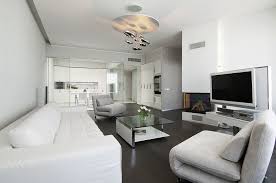 This gorgeous modern living room features dark hardwood flooring that simultaneously contrasts and picks up some of the more orange tones of the wood of this open, spacious living room has wide plank hardwood floors in a rich black stain that matches the minimalist cabinetry and dark furniture. Pin On Estonia