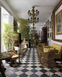Black And White Marble Checkered Floor Tile 18th Century Black Slate And Marble Tiles Create A Stunning Checkerboard Floor In This Madrid Spain Home Sunroom Decorating Sunroom Designs Decor