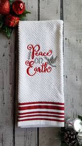 Embroidered White With Red Stripes Kitchen Towel Peace On Earth Towel Measures Approximatel Christmas Kitchen Towels Kitchen Christmas Gifts Christmas Kitchen