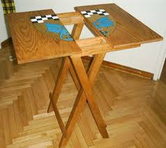 Flip table with attached folding table legs over and look for imperfections in the tabletop. Folding Table