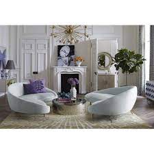 A curved sofa announces to the world that you are on the varsity decorating squad. Jonathan Adler Ether Sofa Curved