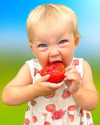 She loves biting into juicy garden fresh tomatoes 🍅