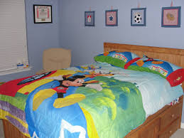 Bold and colourful mickey and minnie themed bedrooms with bedding sets, curtains, wall decor, clocks and stickers. Bedroom Design Mickey Mouse Clubhouse Theme Atmosphere Ideas Themed Curtains Room Batman Set Bed Apppie Org