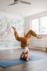 Pregnant In Comfy Clothing Strengthening Body By Doing Supported Headstand Pose On Mat Headstand Poses Headstand Poses