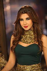nancy ajram wearing rami kadi couture in her latest music video ma awe dak ma ghir nancy ajram women arab celebrities