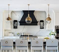 The Kitchen Cabinets Are Painted In Benjamin Moore Swiss Coffee And The Black Hood Paint Color Is Benja Interior Design Kitchen Kitchen Design Kitchen Interior