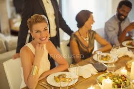 It's fair to say that despite what we in the industry try to do, many people roll their eyes at having to go to. Woman Smiling At Dinner Party African Ethnicity Entertainment Stock Photo 199374180