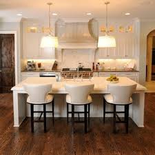 Kitchen island seating for 4 people this kitchen offers a custom island with a marble countertop and has space for a breakfast bar set in the middle and is lighted by pendant lights. Kitchen Island Seat Ideas Houzz