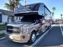 Versatile toy hauling area that can be used to sleep additional people or as a back patio. Thor Outlaw 35sg Super C Toy Hauler Motorhome Rv Ford F 550 6 Vans Suvs And Trucks Cars