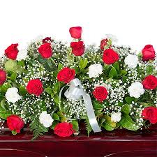 The color or variety of some flowers, plants and containers may be substituted due to regional or seasonal availability. Red Roses White Carnations Funeral Casket Flowers