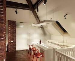 The Art Of Sloped Ceiling Spaces Small Apartment Kitchen Kitchen Decor Apartment Attic Renovation