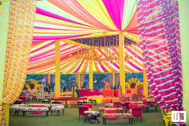 The Shukachari Mehendi A Kaleidoscope Of Colors Theme Weavers Designs Luxury Wedding Venues Mehndi Decor Wedding Venues