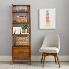 This mid century bookcase with storage features six shelves and a drawer providing the. West Elm X Pbt Mid Century 22 Bookshelf With Storage Drawer Pottery Barn Teen