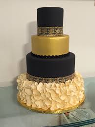Black And Gold Wedding Cake Black Gold And Ivory Wedding Cake With Ruffled Base And Gold Lace Black And Gold Cake Ivory Wedding Cake 70th Birthday Cake