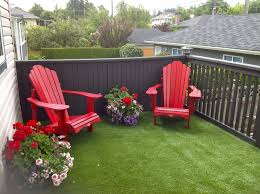 Synthetic Grass Red Chairs Potted Flowers And You Re Good To Relax In Comfort On Your Deck Synlawn W Colorful Patio Furniture Colorful Patio Patio Garden