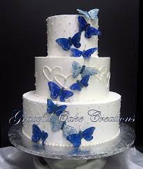 Elegant White Wedding Cake With Butterflies And Hearts Butterfly Wedding Cake Butterfly Cakes Wedding Cake Images