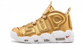 Pattern background gold golden men's lightweight sports shoes. How To Get Cheap Nike Uptempo Supreme Metallic Gold Sneakers