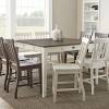 The most common counter height table material is wood. 1