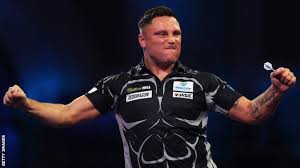 Gerwyn price celebrates with the trophy after winning the world darts championship. Pdc Darts Championship Gerwyn Price And Peter Wright Into Quarter Finals But Adrian Lewis Out Bbc Sport