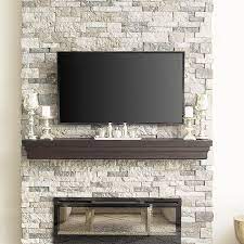 Creating a stacked stone fireplace is a great way to update your décor while also increasing your home value. Stone Fireplace Electric Fireplace Faux Stone Mantle Decor Stone Veneer Faux Mantle Faux Stone Fireplaces Fake Fireplace Stone Veneer Fireplace